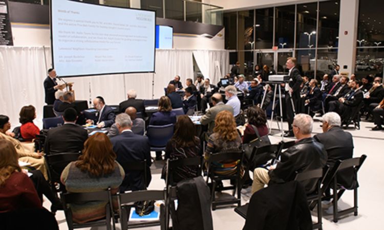 Image of Residents, representatives from neighborhood organizations, City staff, and the NCI design team talk through potential design solutions in the neighborhood during the charrette.