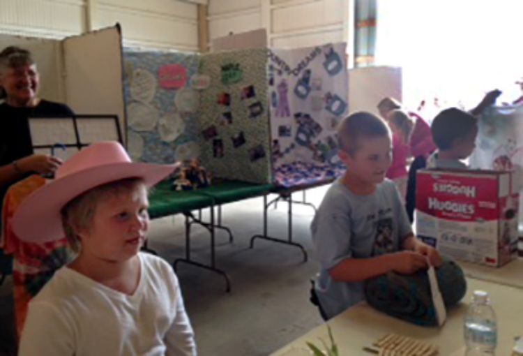 4-H Cloverbuds show off their projects at the county fair.