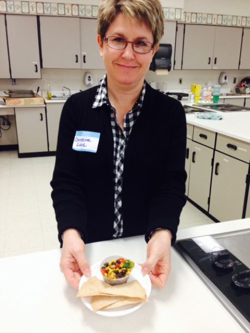 Food Service Director, Christine Luce shows off a sample of ‘Cowboy Salad,’ a prepared salad featured on the school salad bar that includes a mix of black beans, corn, tomatoes, peppers and herbs and spices.