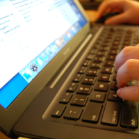 closeup of hands on keyboard