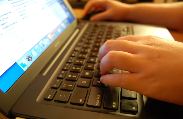 closeup of hands on keyboard