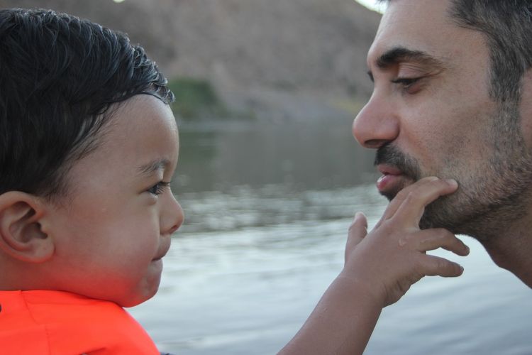 Children learn to communicate with others through gestures and facial expressions.