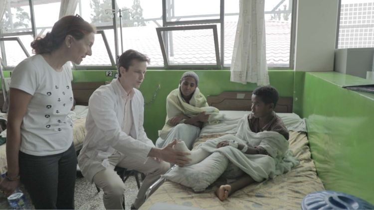 Dr. Richard Gardner explains to MSU faculty member Dr. Julia Bello-Bravo treatment procedures of a patient in the CURE Children's Hospital In Ethiopia.