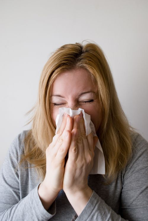 Woman sneezing