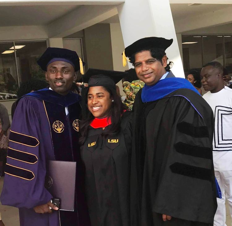 Emmanuel Kyereh (left) stands with fellow graduates from Louisiana State University.