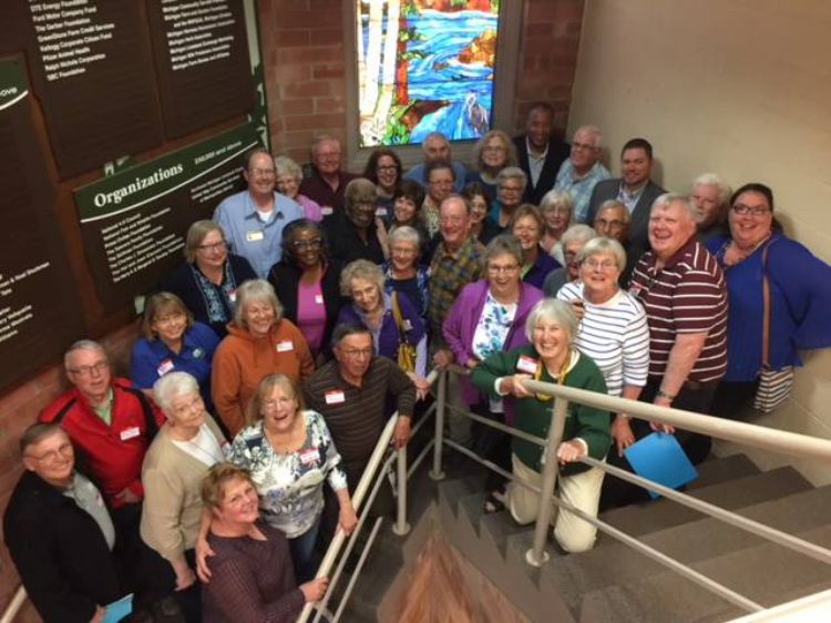 People gathered at the steps in Kettunen Center.