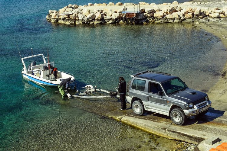 Loading a boat onto a trailer, after spending a day on the water