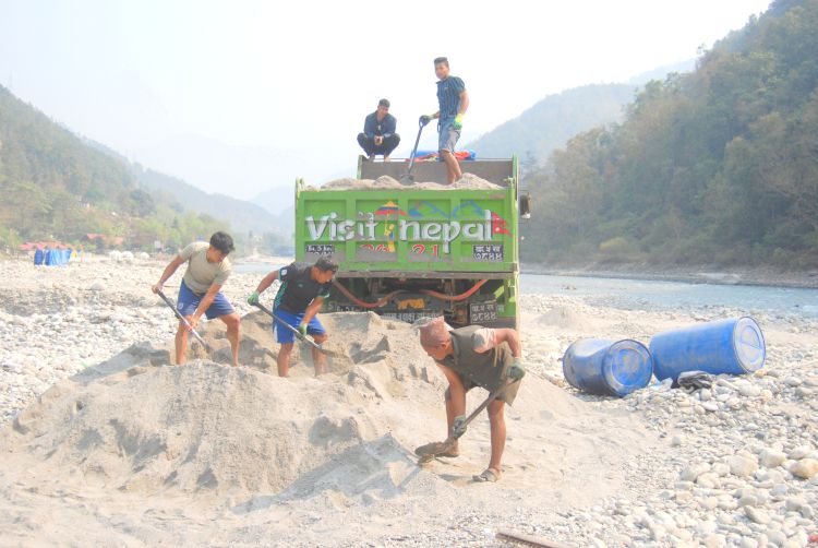 Men digging sand