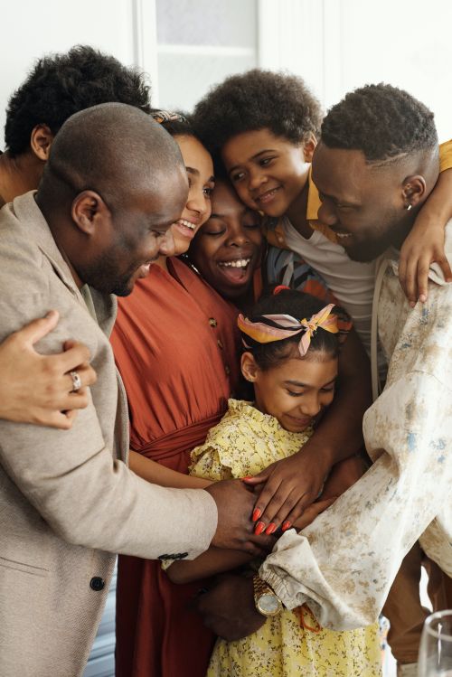 A family giving each other a big group hug.