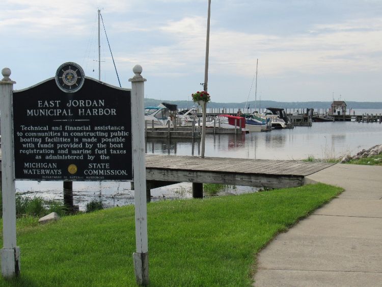 A sign in front of a boat dock