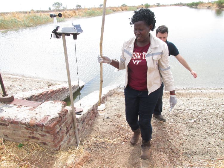 Flora Lado collects water and soil samples in South Sudan.