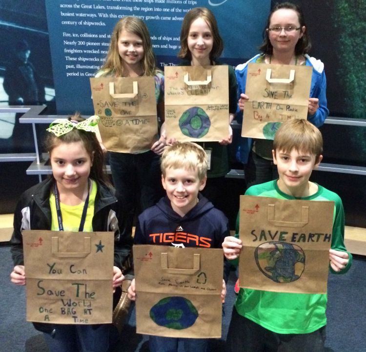 Ella White Elementary students decorate paper grocery bags to educate community about the issue of plastic pollution and marine debris on Earth Day. Photo Credit: Meaghan Gass