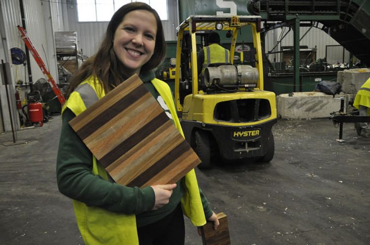 MSU student Tiffany Pupa shows off the countertops made at MSU for the Sparty's Cabin project