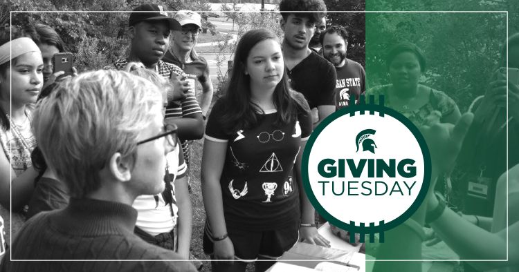 Giving Tuesday button with a group of MSU students.