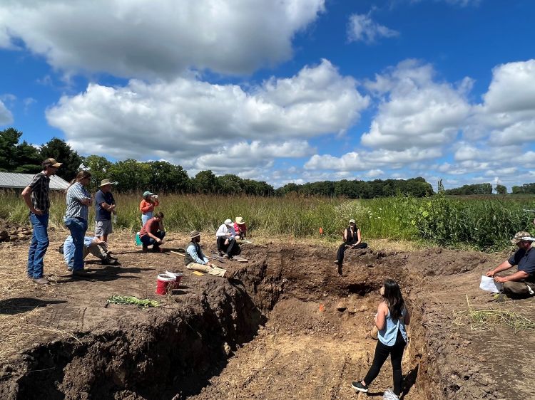 People working in a field.