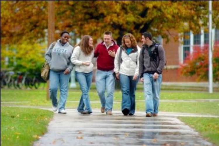 A group of students walking on campus.