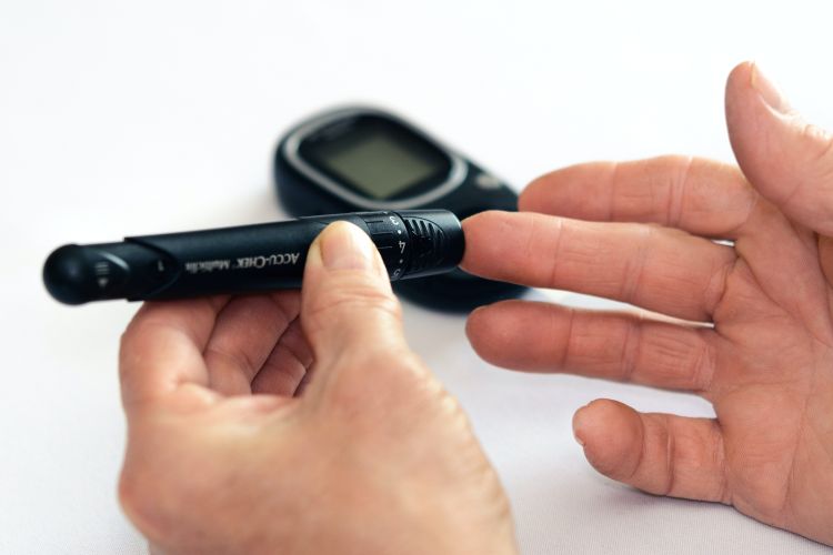 A person testing their blood sugar.