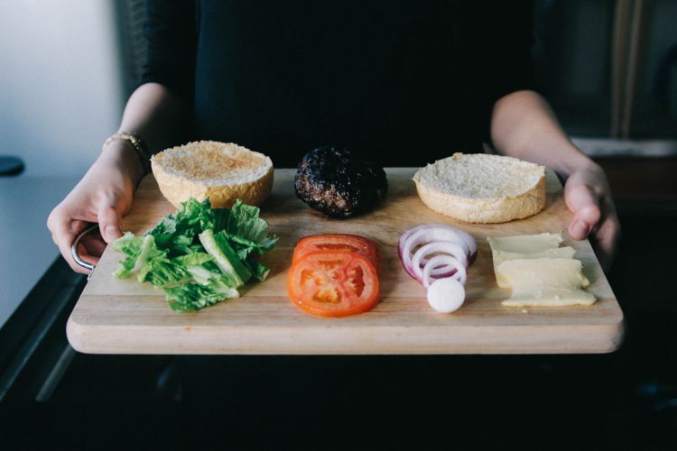 Wash your hands well after working with hamburger before putting the lettuce, tomatoes and onion on your bun to prevent cross-contamination.