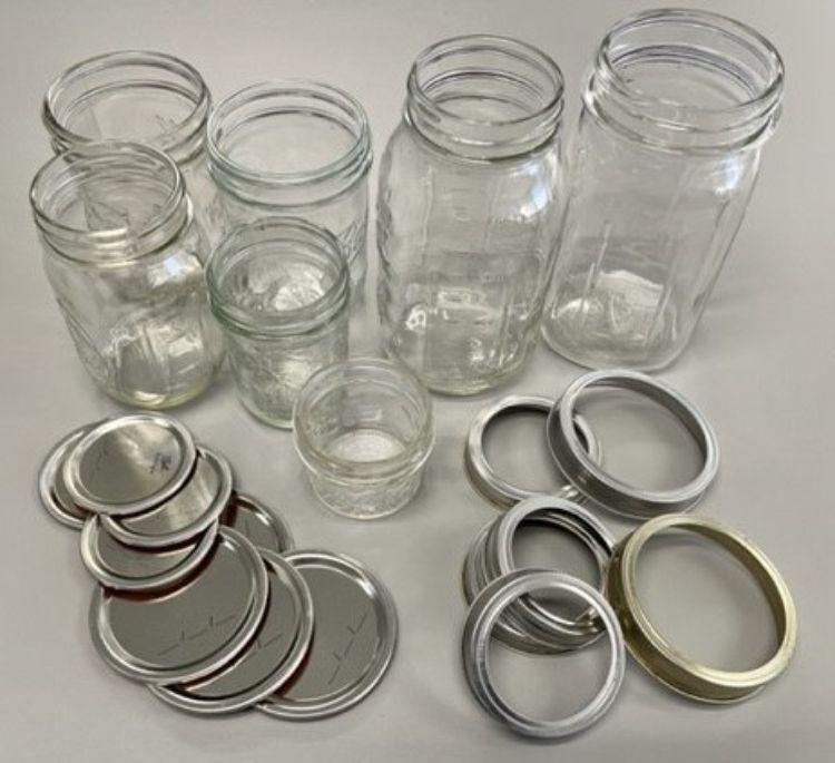 Various canning jars and lids.
