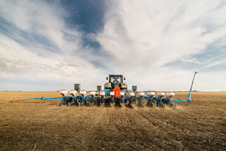 A tractor seeding.