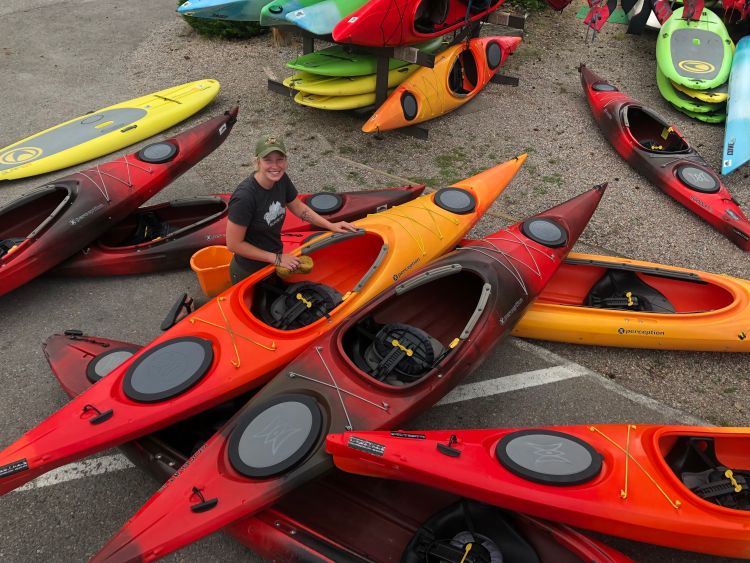 Audrie Adams works as an intern at a kayak outfitting business