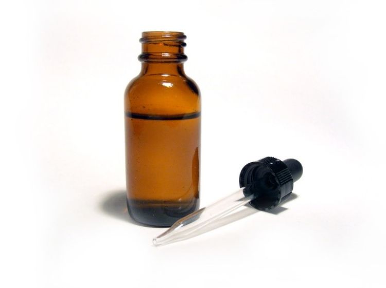 A bottle and liquid dropper.