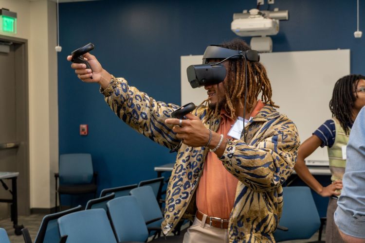 Upward Ground attendee using a VR headset.