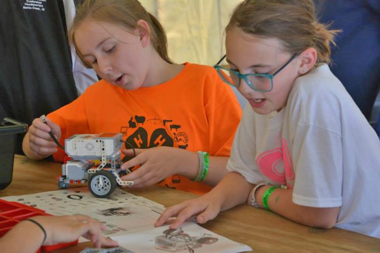 Eaton County 4-H girls participating in the 2014 regional 4-H Robotics Challenge. Photo by Jamie Wilson.