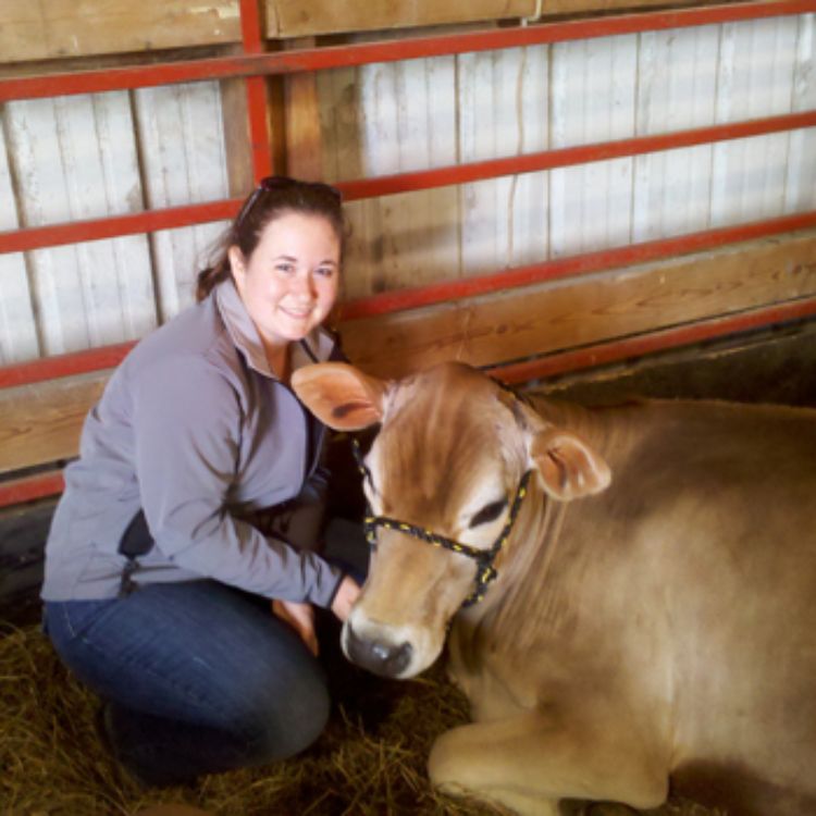 Nicole Olynk Widmar with her cow Miss Pixie