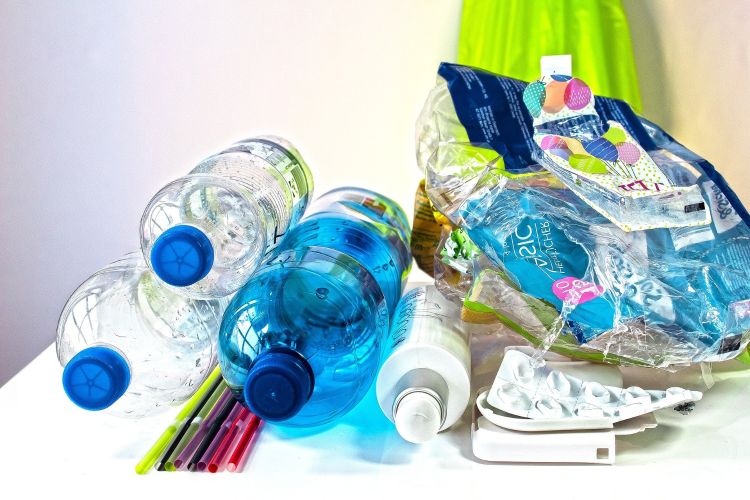 Bottles and mixed plastic waste to be recycled.