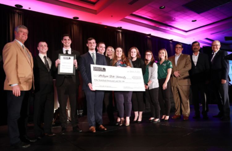 Photo of Construction Management faculty and students receiving the the Homebuilding Education Leadership Program grant award from the National Housing Endowment.