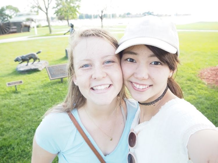 Host Maggie Nagle (left) and Japanese chaperone Mai (right) at the Ludington Marina.