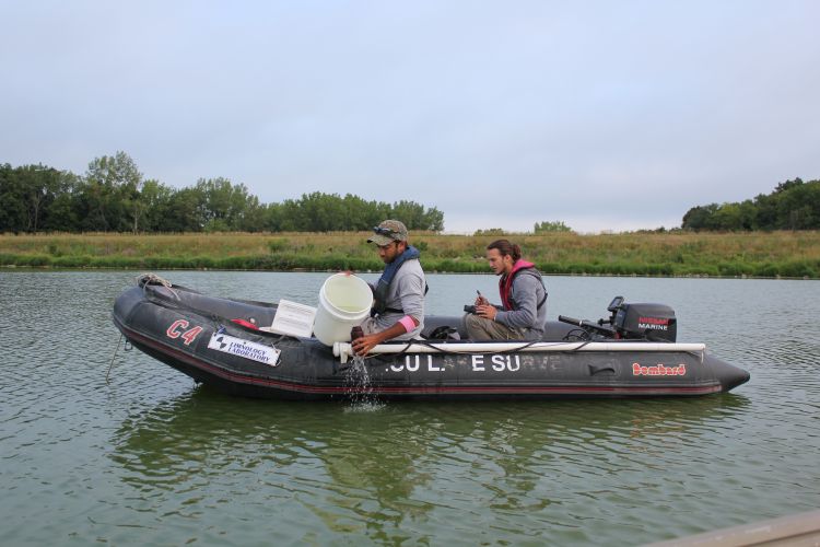 Iowa State University student field technicians sample a lake in Iowa for the state's water quality monitoring program. Photo: Daniel Kendall, Iowa State University, Agriculture Communications