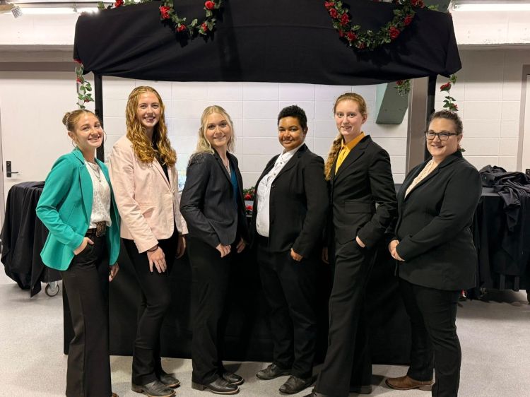A group of young people in suits.
