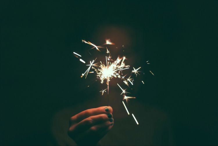 Hand holding a sparkler