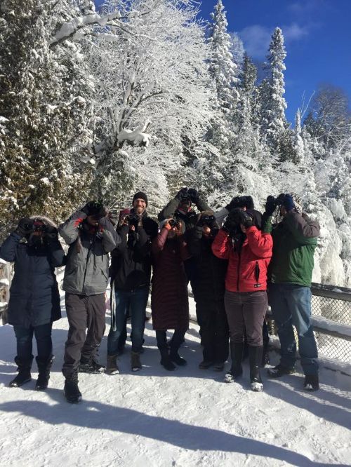 Birders are all bundled up at Tahquamenon Falls in the winter. Photo: Elliot Nelson | Michigan Sea Grant