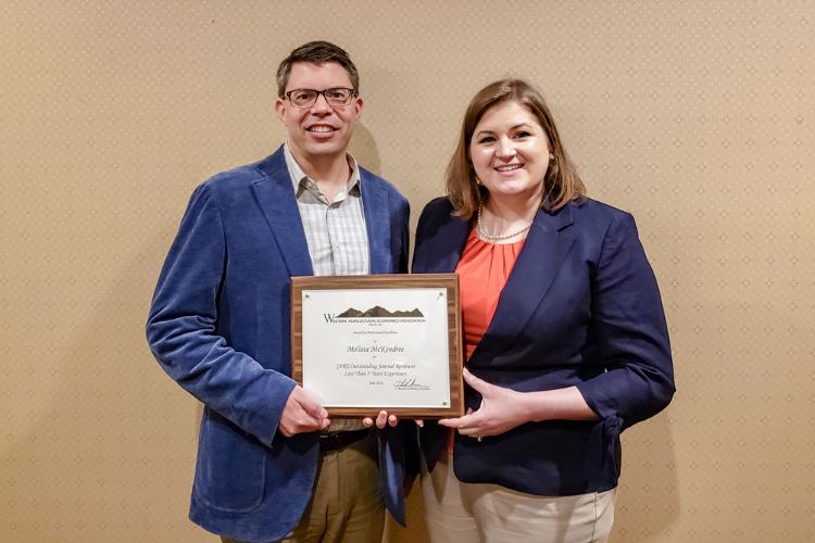 Melissa McKendree with her Outstanding Reviewer Award