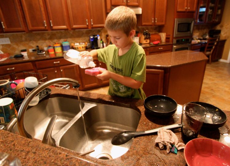 Simple household tasks like washing the dishes are self-help skills. Image courtesy of Roy Luck via Flickr, CC BY 2.0.