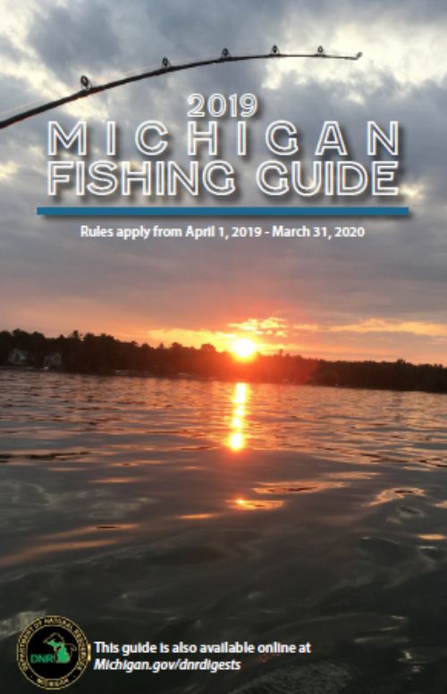 The cover of the Michigan Department of Natural Resources fishing guide for 2019 shows a sunset over a lake with the sun's reflection in the water.