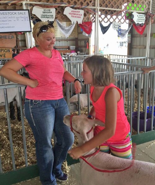 MSU Extension educator Katie Ockert and youth exhibitor Kassidy at the Berrien County Fair. Photo by Sheila Smith, MSU Extension.