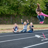 Girl jumping up high