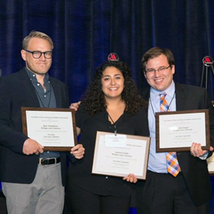 AFRE students Ryan Vroegindewey, Samantha Padilla, and Stephen Morgan after winning the AAEA student case competition