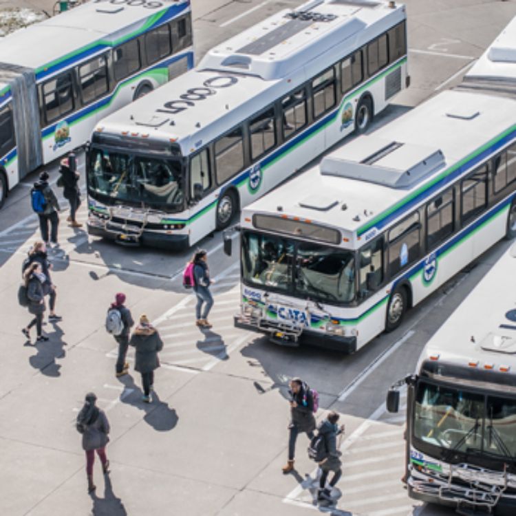 CATA bus riders getting on buses at transit station. Photo by MSU CABS.