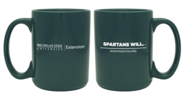 Photo of dark green extension mug with MSUE logo and Spartans Will printed on it.
