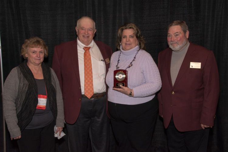 Diane Brazier (second from right) receiving her award. Also pictured are Cinda Karlik, Mich. Dept. of Agriculture and Rural Development liaison, LC Scramlin, MAFE Awards Committee, and Ric Crawford, MAFE President. Photo credit: MAFE and Bruce Doll. 