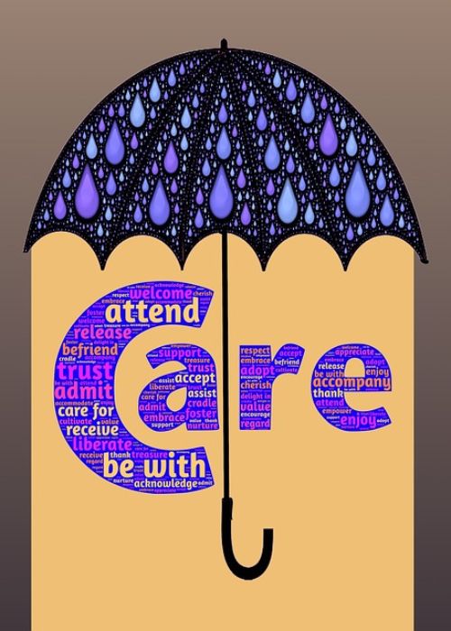 Umbrella with the word care underneath