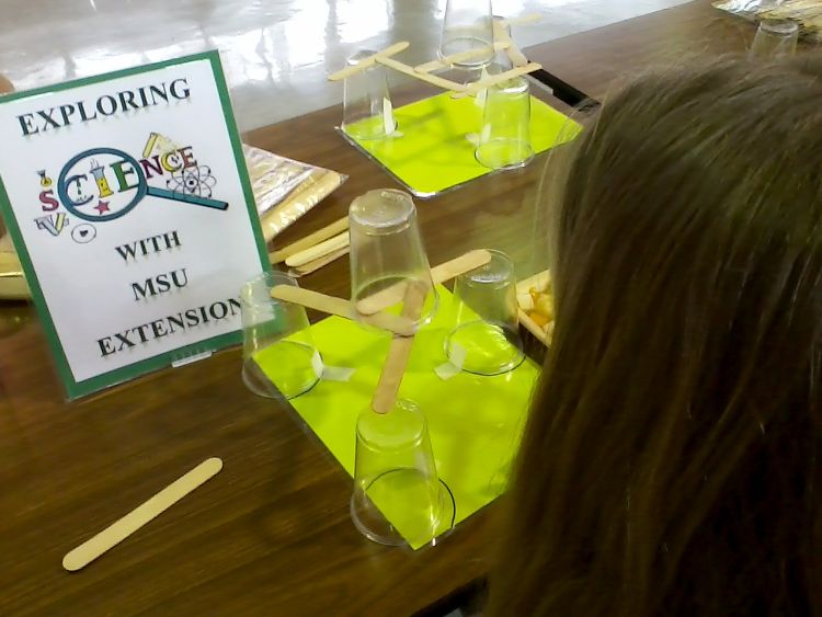 This STEM lunchtime challenge involved building a platform suspended between three cups that could hold a fourth cup using the least number of craft sticks possible – with the cups placed too far apart for just one craft stick to reach!