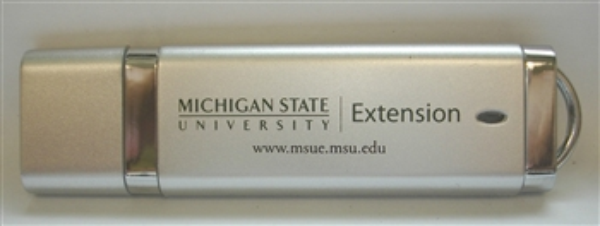 Photo with MSU Extension flash drive.