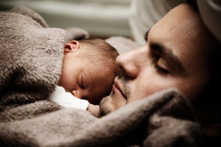 Father and baby snuggling