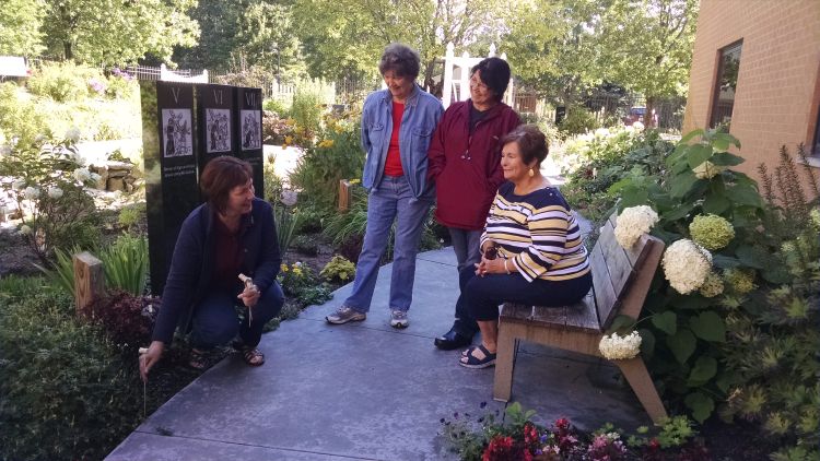 Michigan Advanced Master Gardener Sue Wanic (left) works with other Master Gardeners, Greta Arntzen, Sue Shepich and Debbie Stearns, within The Serenity Garden. Photo by Rebecca Krans, MSU Extension